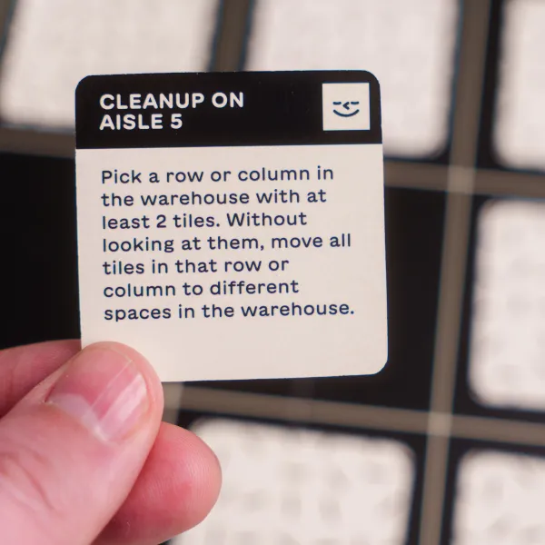 Players sorting tiles on the warehouse board