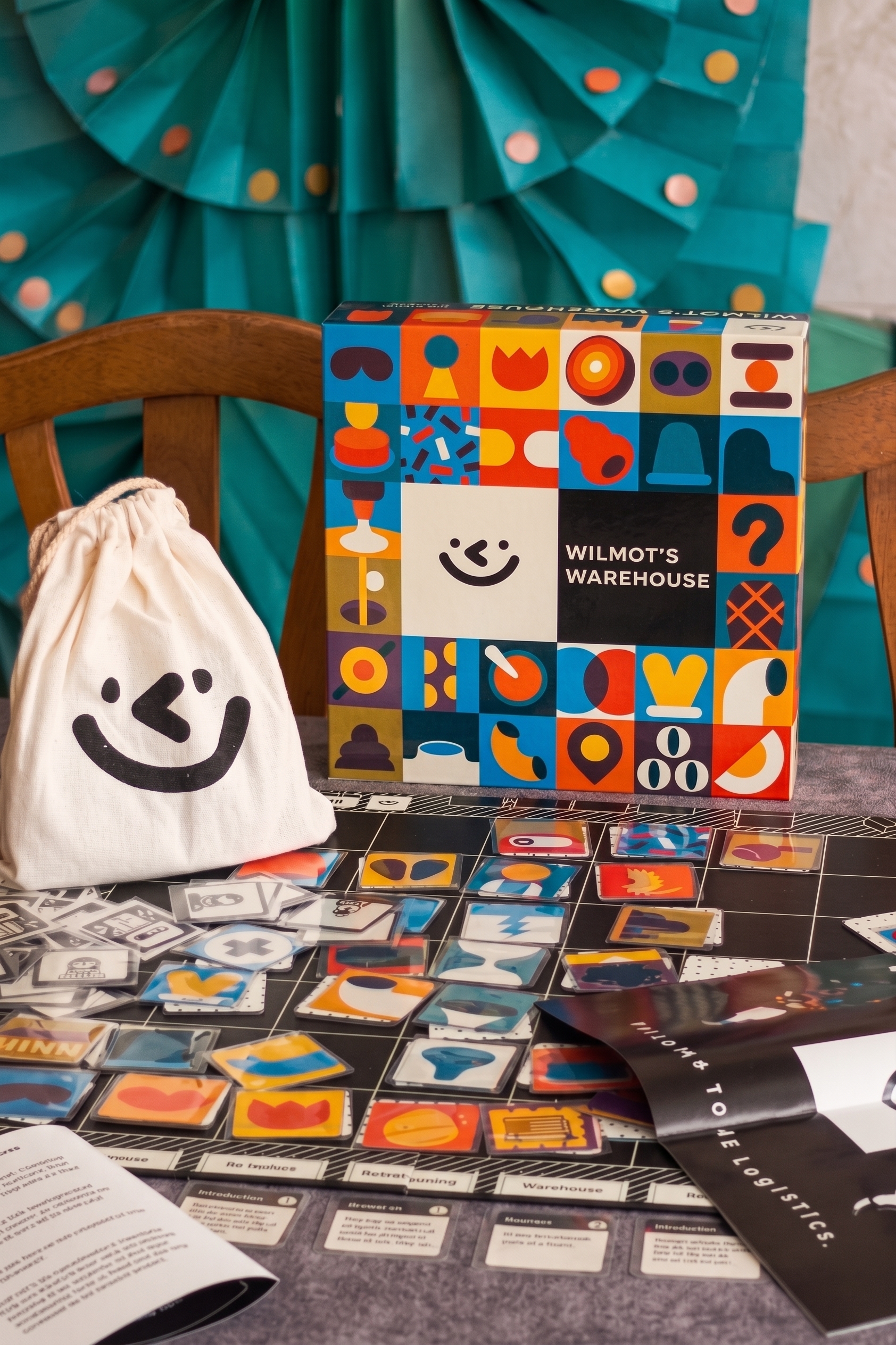 Game box, cloth bag, and tiles spread across the board